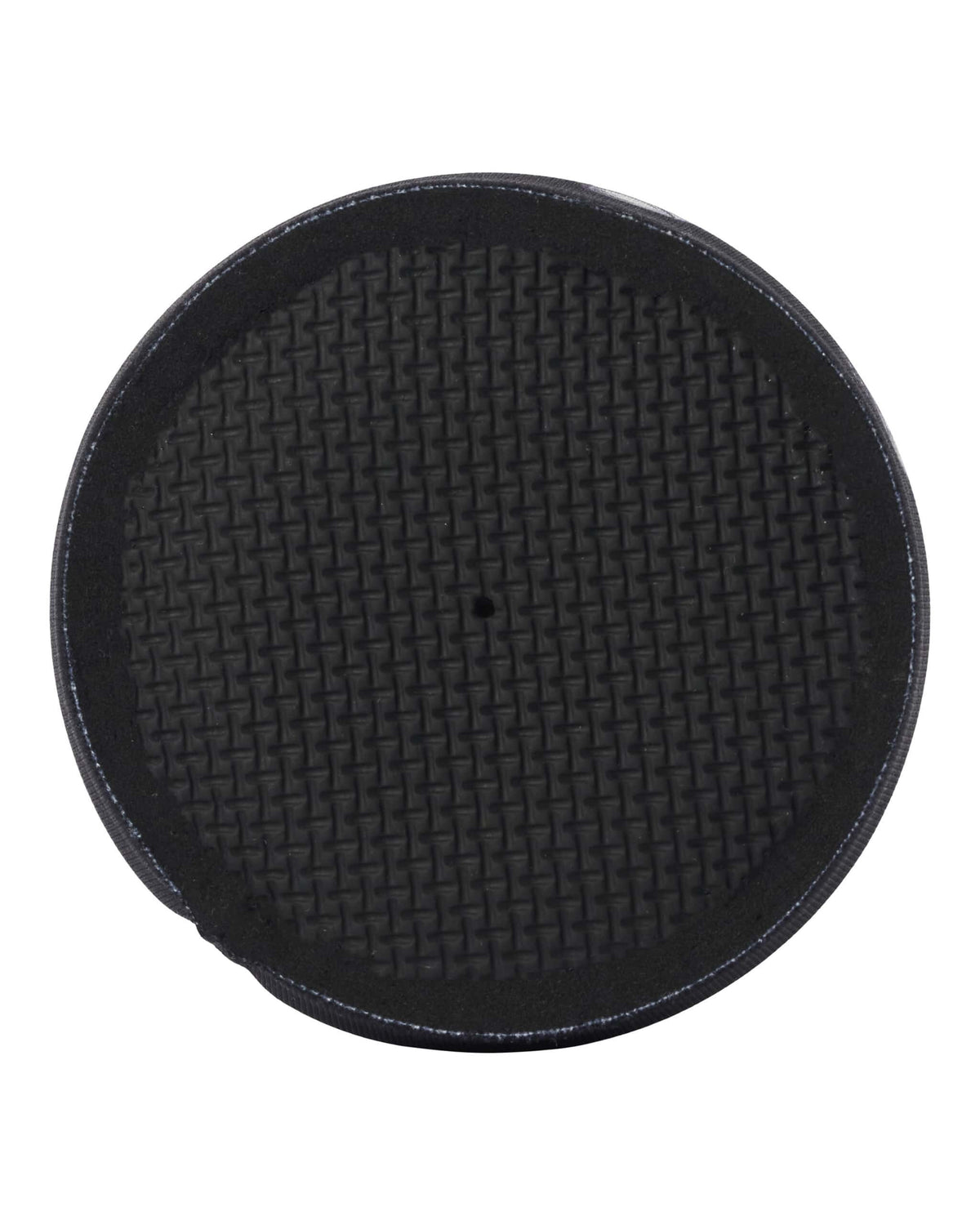 Detail of the textured, patterned base of a black neoprene beer koozie with a small center drainage hole.