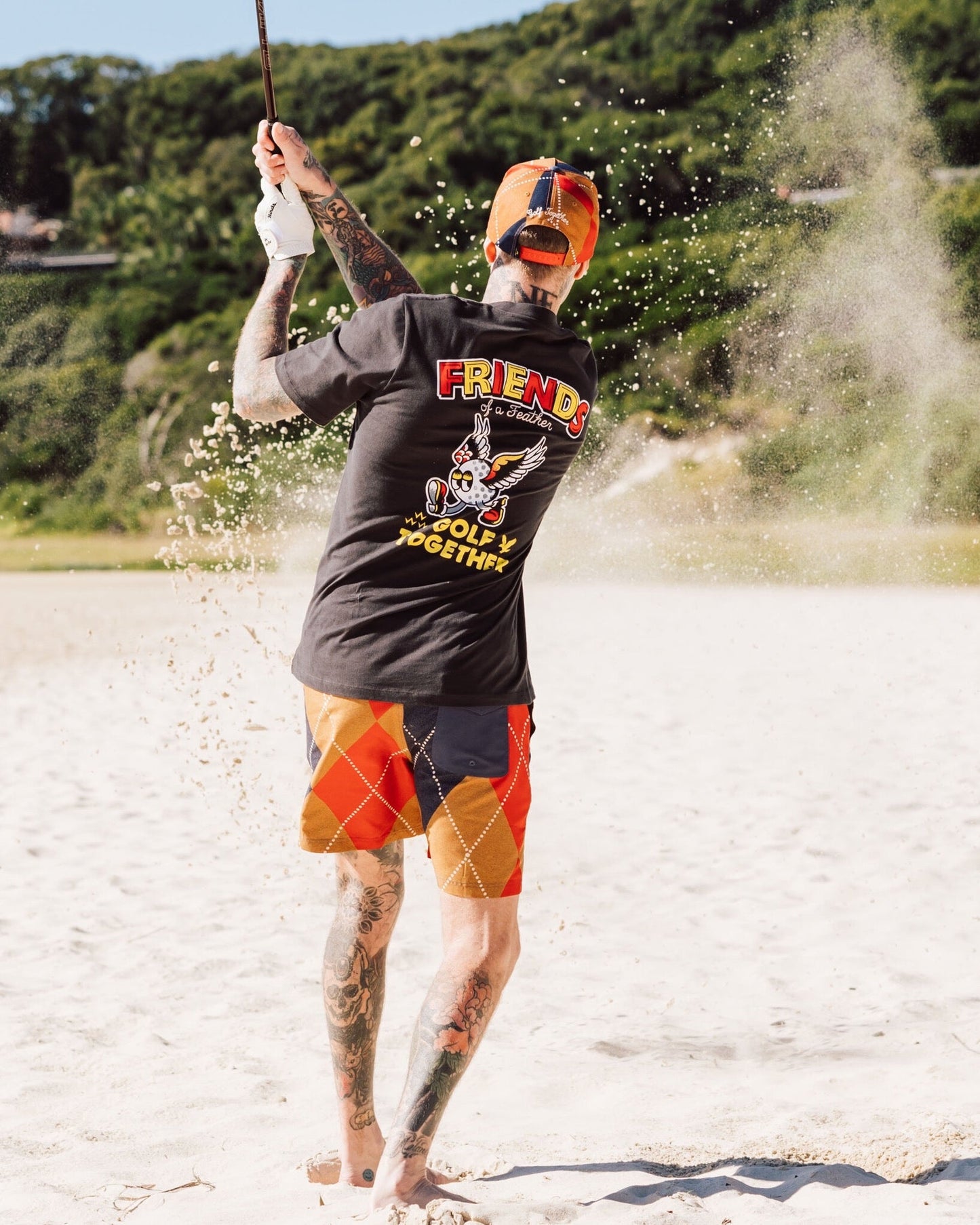 Back of a phantom t-shirt featuring a colourful Friends of a Feather graphic and text print.