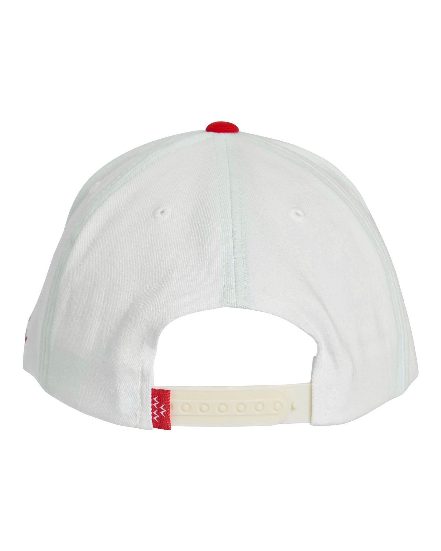 Back of an off-white 5-panel cap with a red top button and a plastic snapback closure featuring a small red tag.
