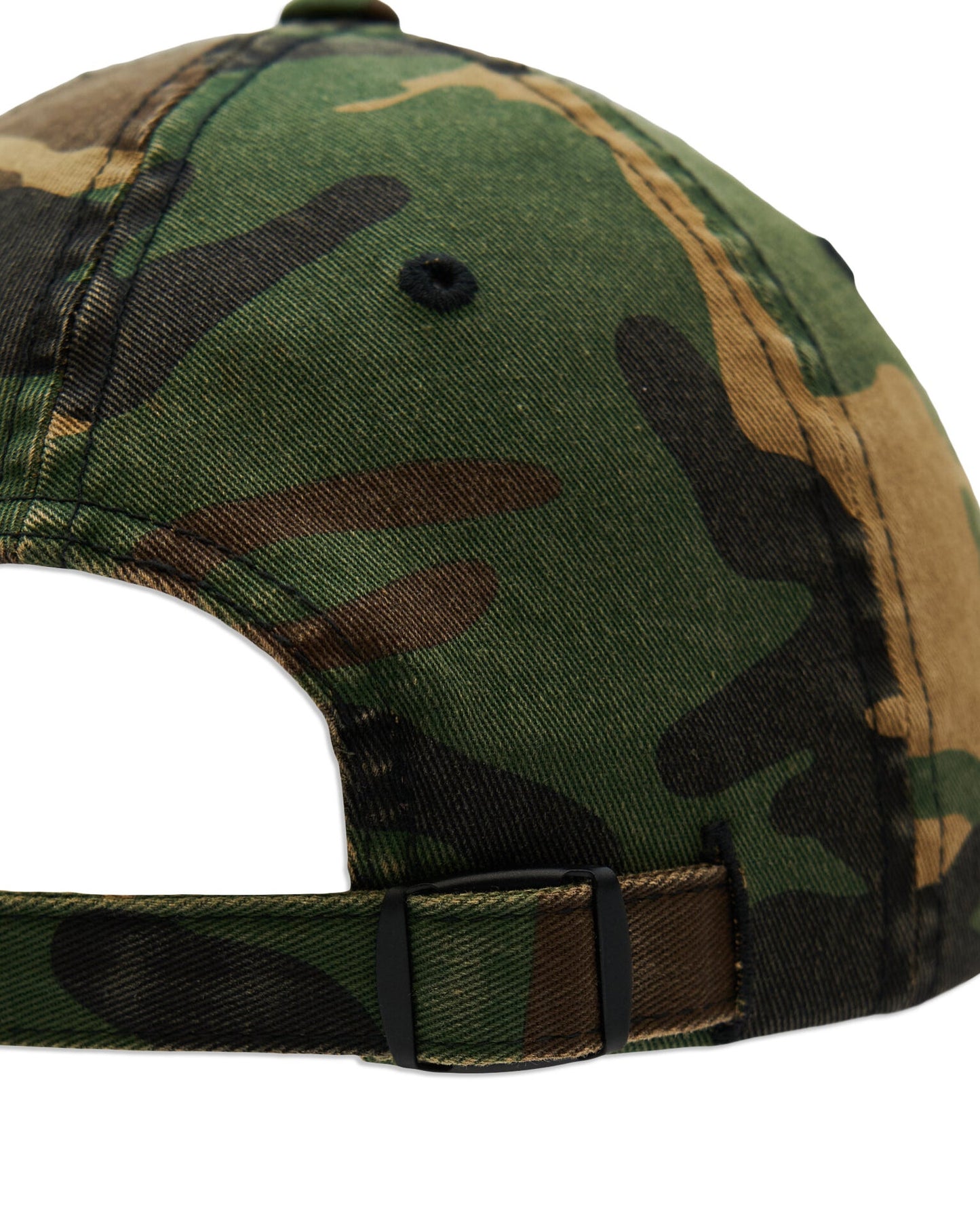Back of a camo cotton cap featuring an adjustable strap with a black metal buckle.