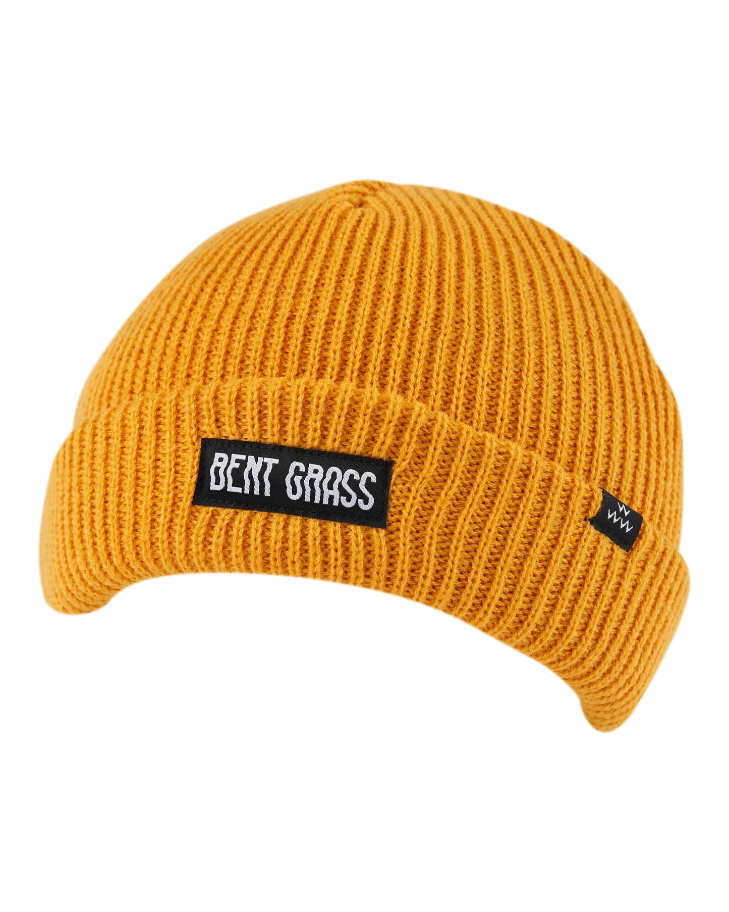 Mustard ribbed knit beanie featuring a black rectangular patch with white Bent Grass text on the front.