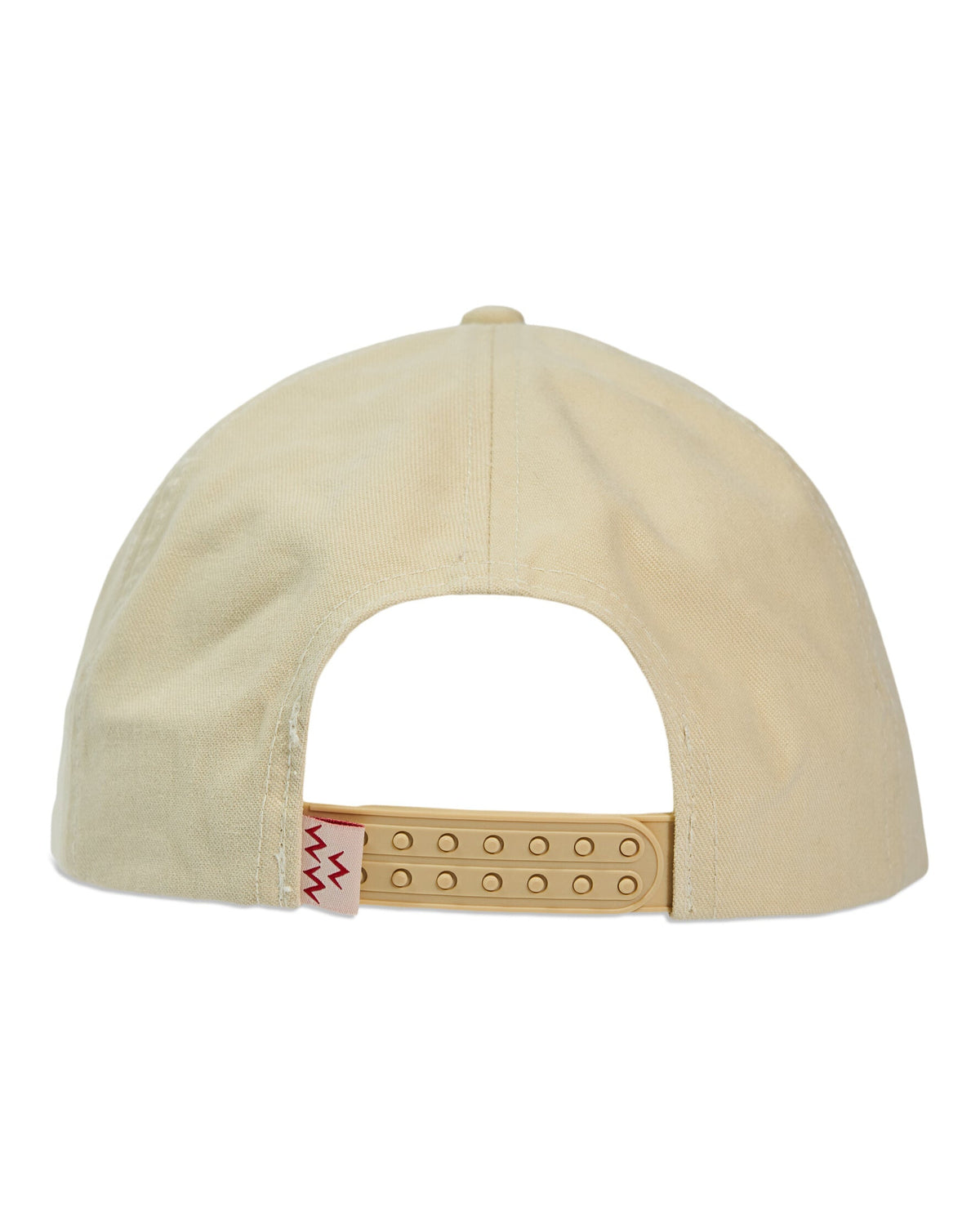 Back of a cream snapback with a double-plug strap closure and a red zigzag woven side tab.
