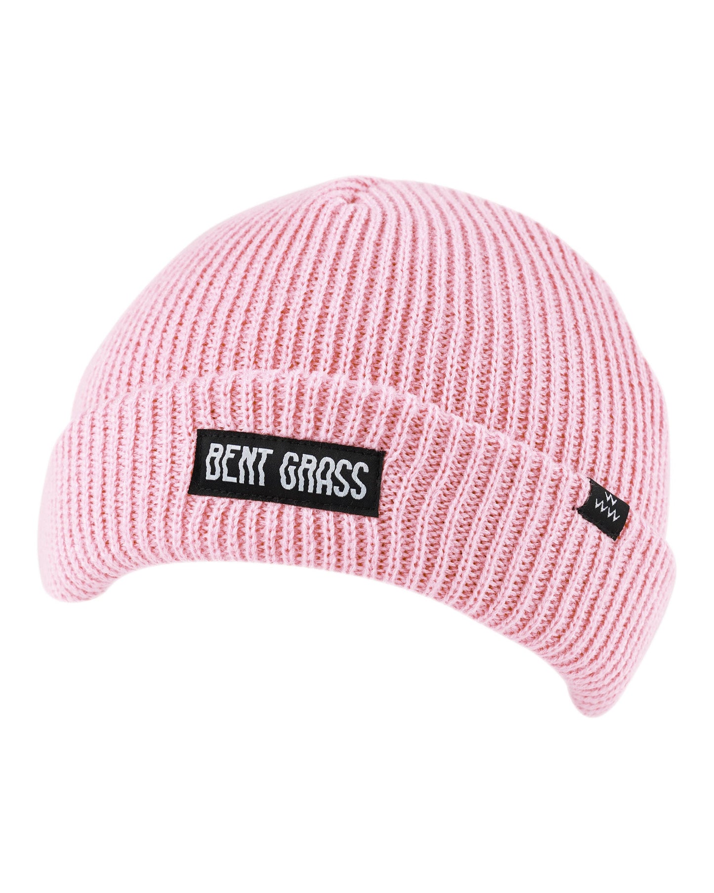Pink ribbed knit beanie featuring a black rectangular patch with white Bent Grass text on the folded cuff.