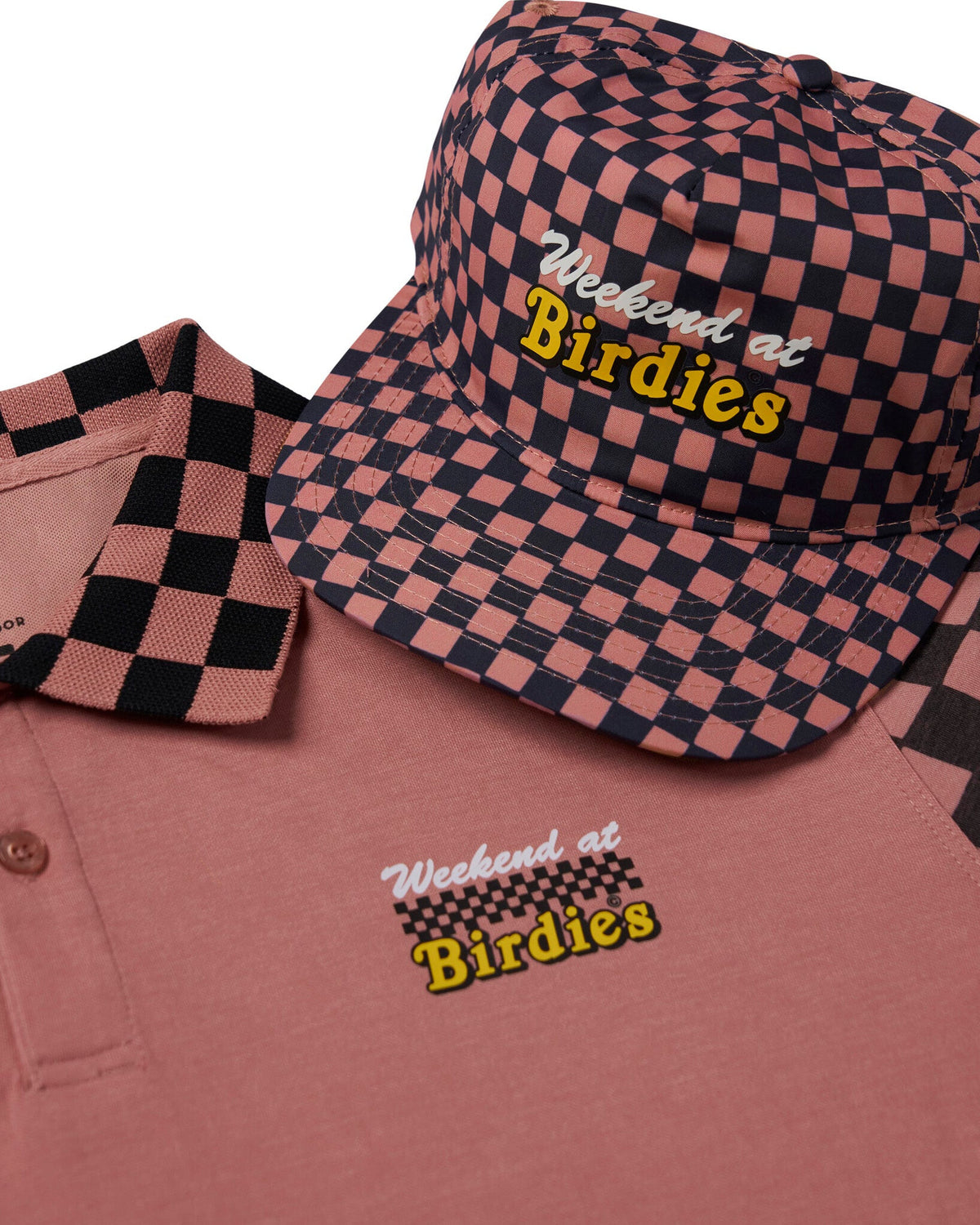 Old rose polo shirt with black checkered collar and a matching cap, both featuring a Weekend at Birdies logo.