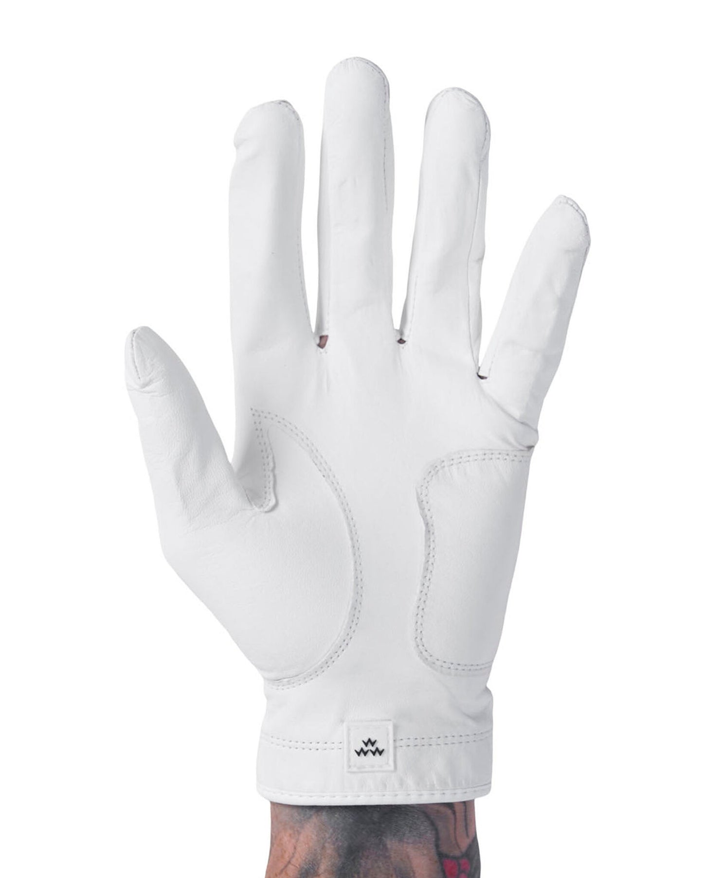 Front of a white golf glove featuring stitched palm reinforcement panels and a small square wrist logo tag.
