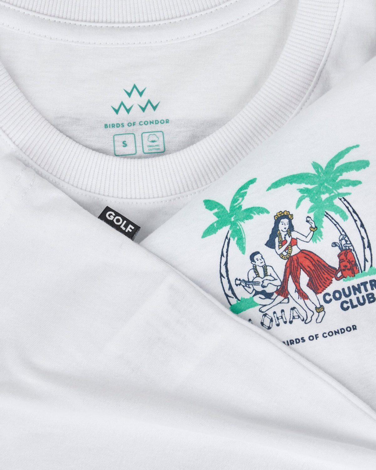 Detail of a white cotton t-shirt featuring a hula dancer graphic and a branded inner collar.