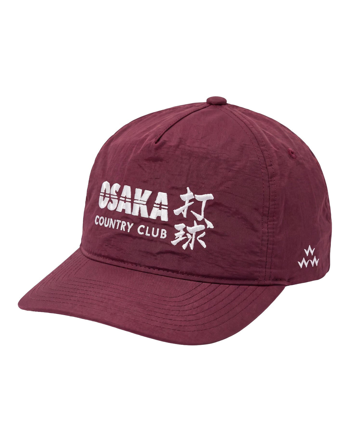 A maroon baseball cap featuring white embroidered text on the front that reads 'OSAKA COUNTRY CLUB' alongside Japanese characters, and a small white logo on the side, set against a plain white background.