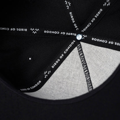 Interior close-up of Black 5-Panel Golf Cap showcasing Signature Birds of Condor Internal Taping.