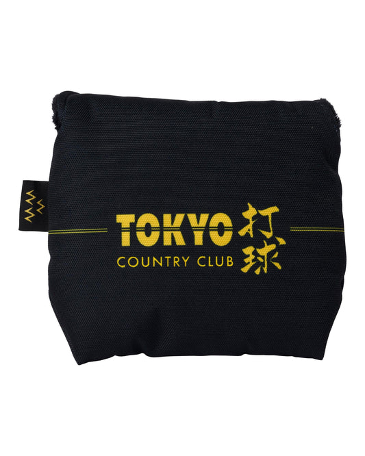 Black mallet putter cover with yellow Tokyo Country Club lettering and Japanese characters across the front.