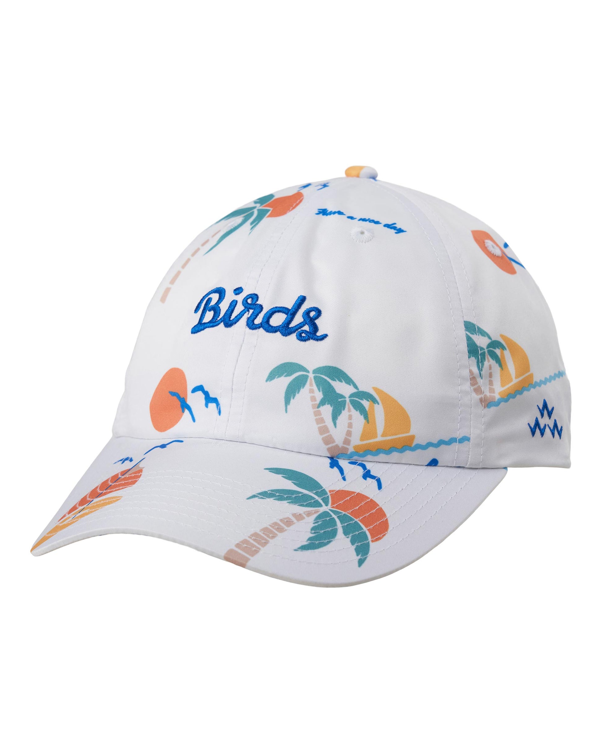 A white baseball cap featuring a colorful tropical beach print with palm trees, sunsets, waves, and the word 'Birds' embroidered in blue on the front.
