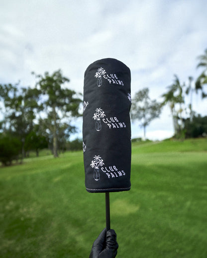 Black driver headcover featuring repeated white palm tree logos and Club Palms text.