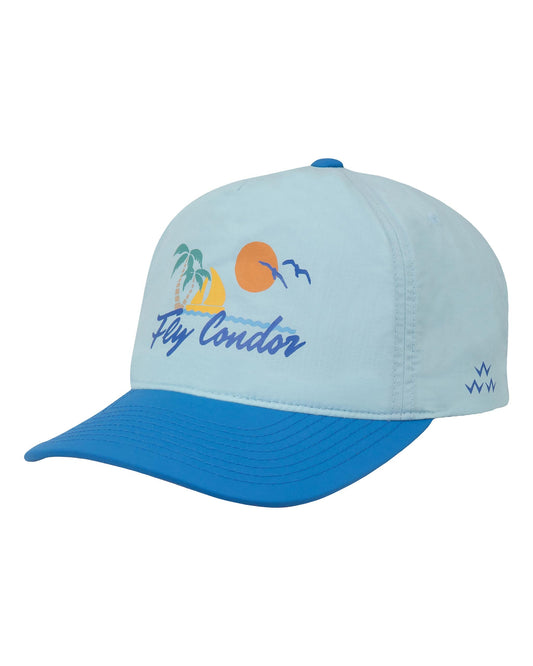 Sky blue nylon five-panel cap with royal blue brim, featuring a tropical sunset design and Fly Condor print.