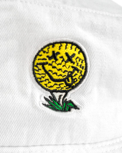 Detail of a white cotton boonie hat featuring a yellow golf ball smiley face design on a white tee.